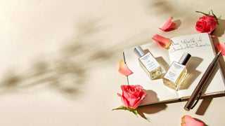 Image of two 15ml perfume, a pen and a notebook with Chandrika's Notes